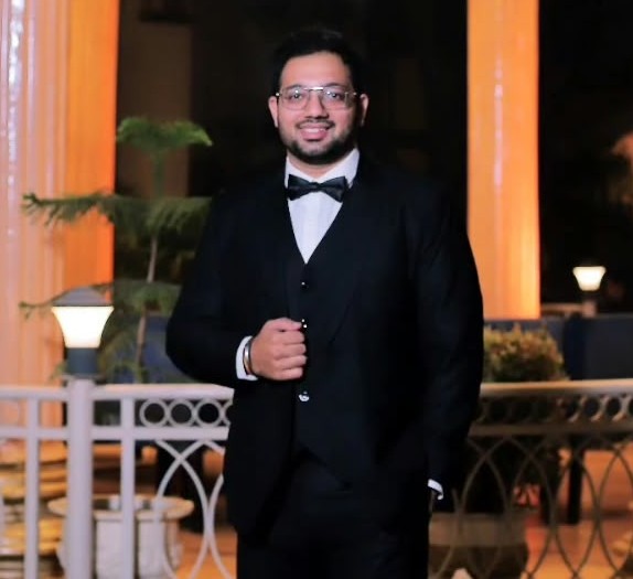 Founder of WebNest Studio in formal black-tie attire